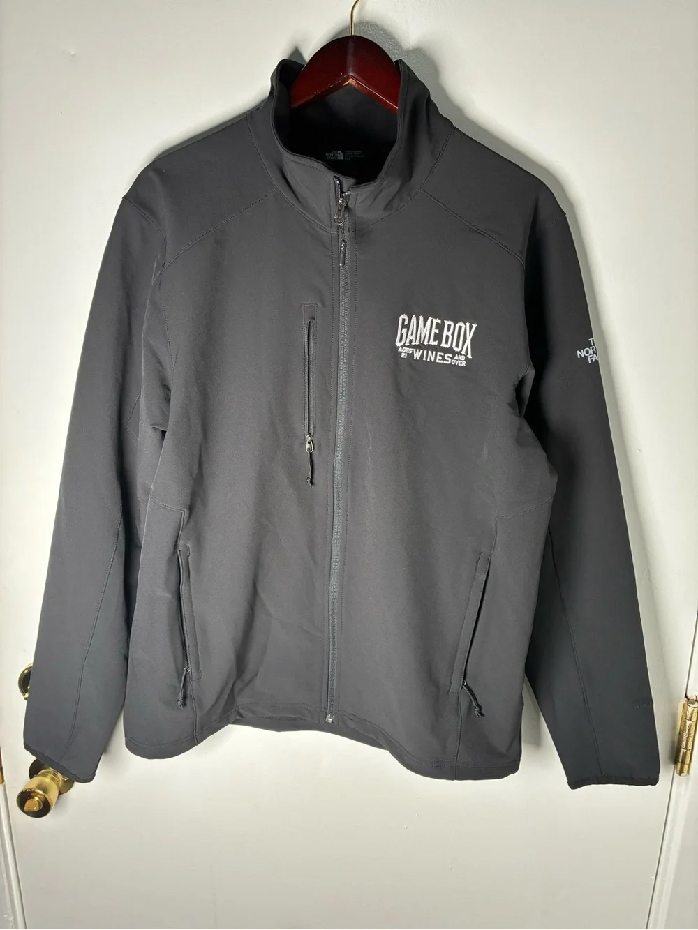 The North Face Men's Dark Black Softshell Jacket with Game Box Wines Logo Size L